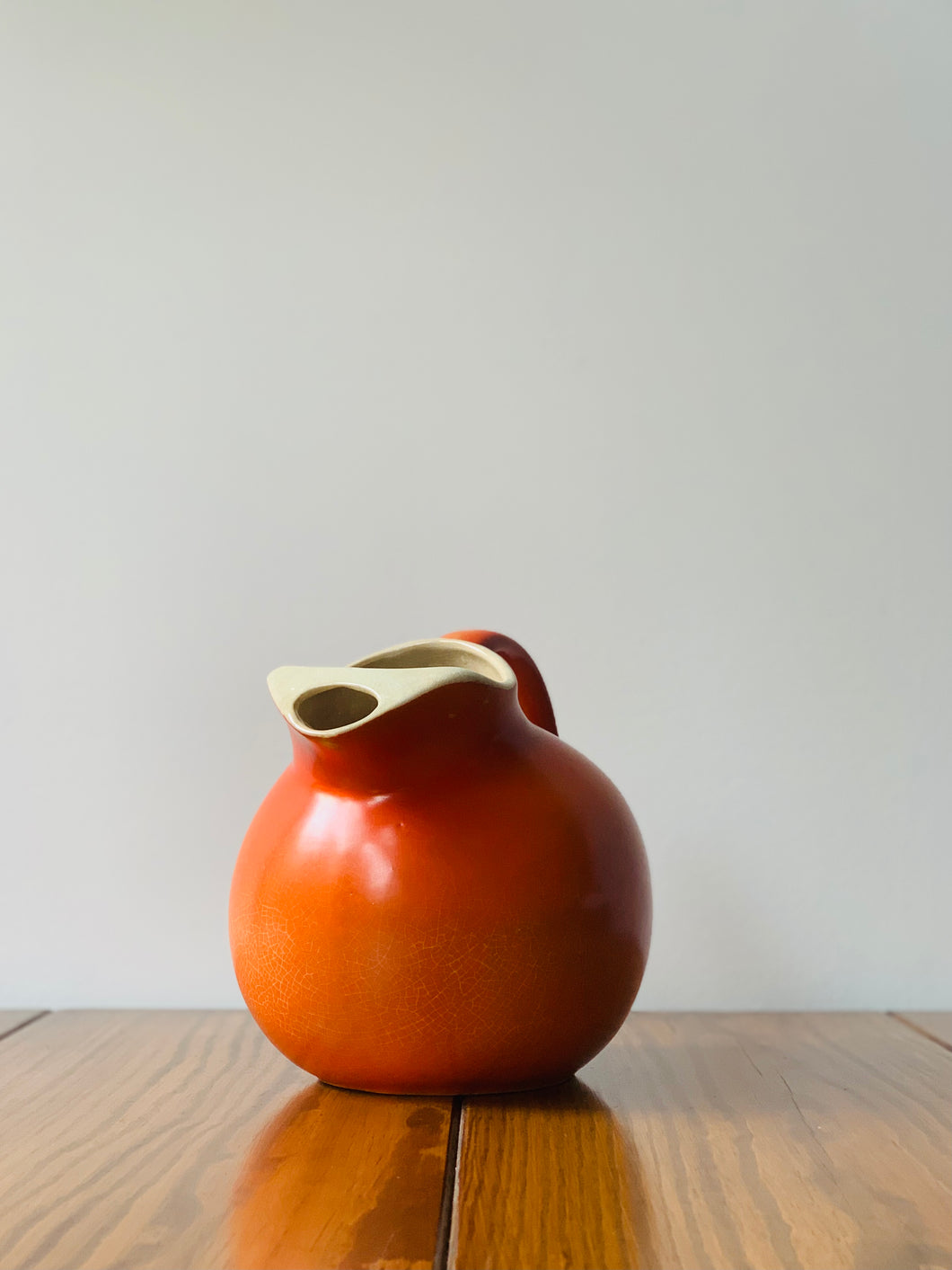 mid-century, deep orange pitcher